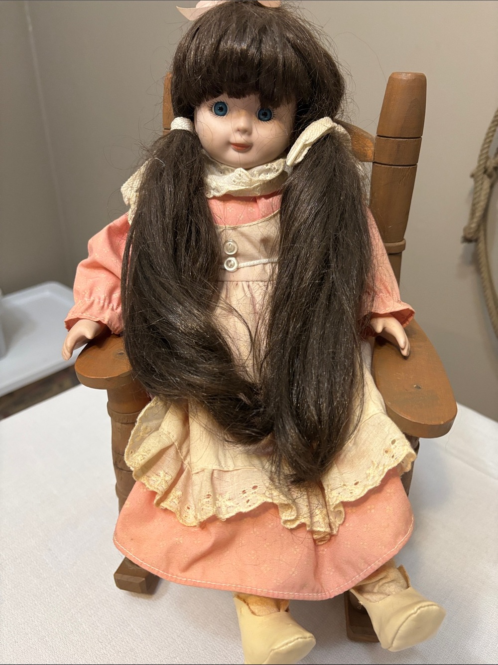 Classic Porcelain Doll with Long Brown Hair & Wooden Rocking Chair